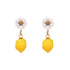 Whimsical stud earrings featuring a daisy flower and a dangling lemon, made of 316L stainless steel.