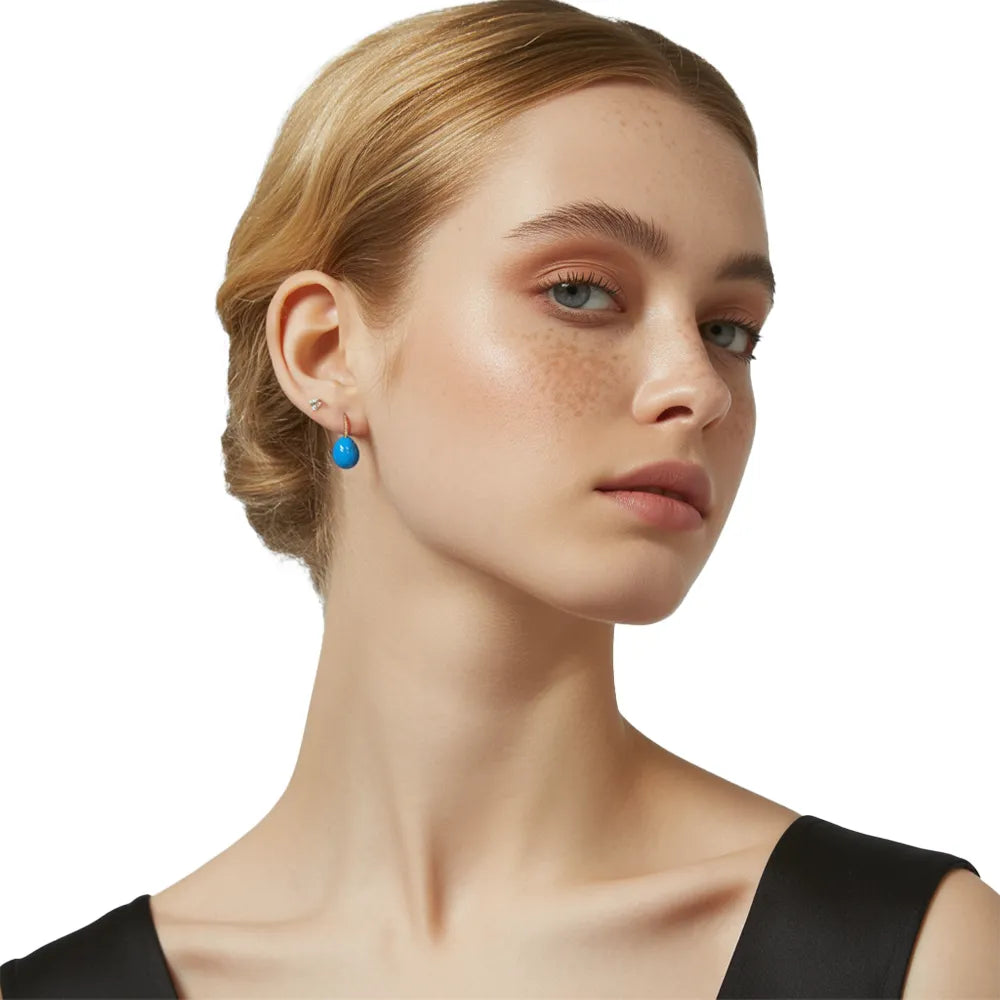 Model wearing the royal blue Elara Enamel Drop Earrings.