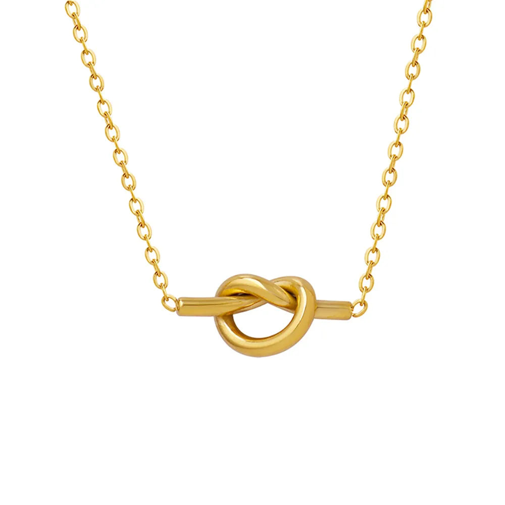 The Elara Knot Heart Pendant in 18k gold plate, showcasing its unique love knot design on a white background