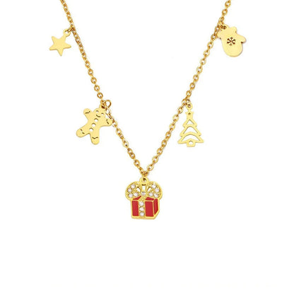 The Festive Enamel Charm Necklace with three holiday-themed pendants, shown on a clean white background