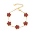 The 18k gold plated Fleur Bloom Bracelet featuring a bold red agate five-petal flower, shown on a white background