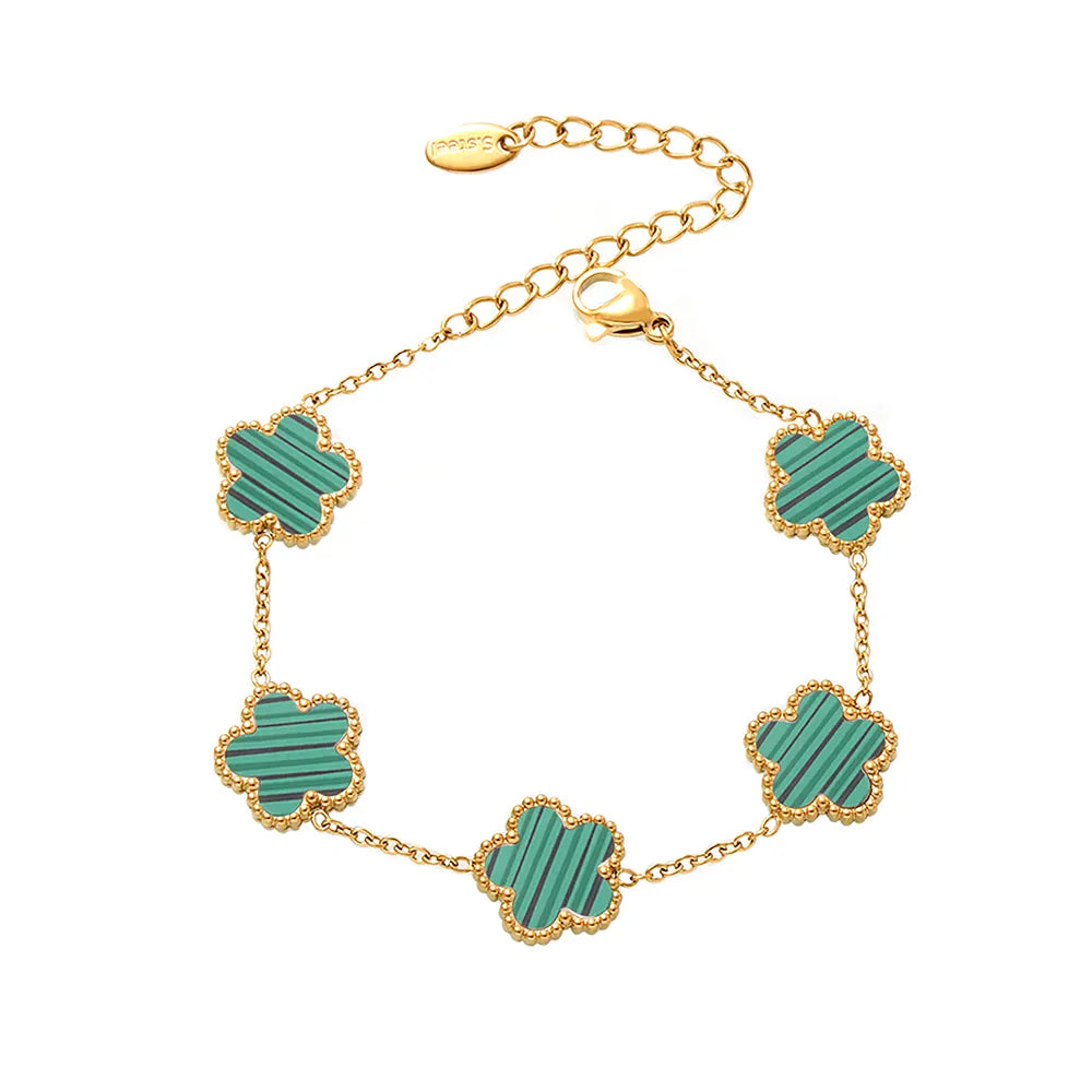 The Fleur Bloom Bracelet in 18k gold plate, showcasing the five-petal flower design with a vibrant turquoise stone.