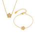 The Flora Pavé Flower Jewelry Set in 18k gold, including the necklace and bracelet.