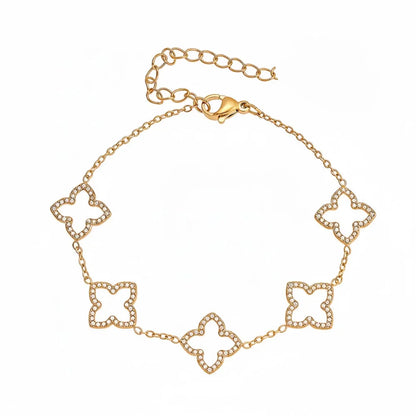 The Fortuna Clover Bracelet in 18k gold plate, featuring alternating pavé zirconia and polished clovers, on a white background