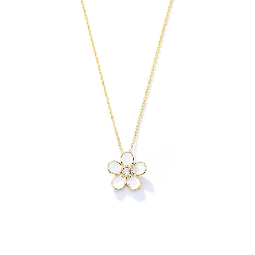 S925 sterling silver gold-plated necklace with a dainty white enamel flower pendant on a white background