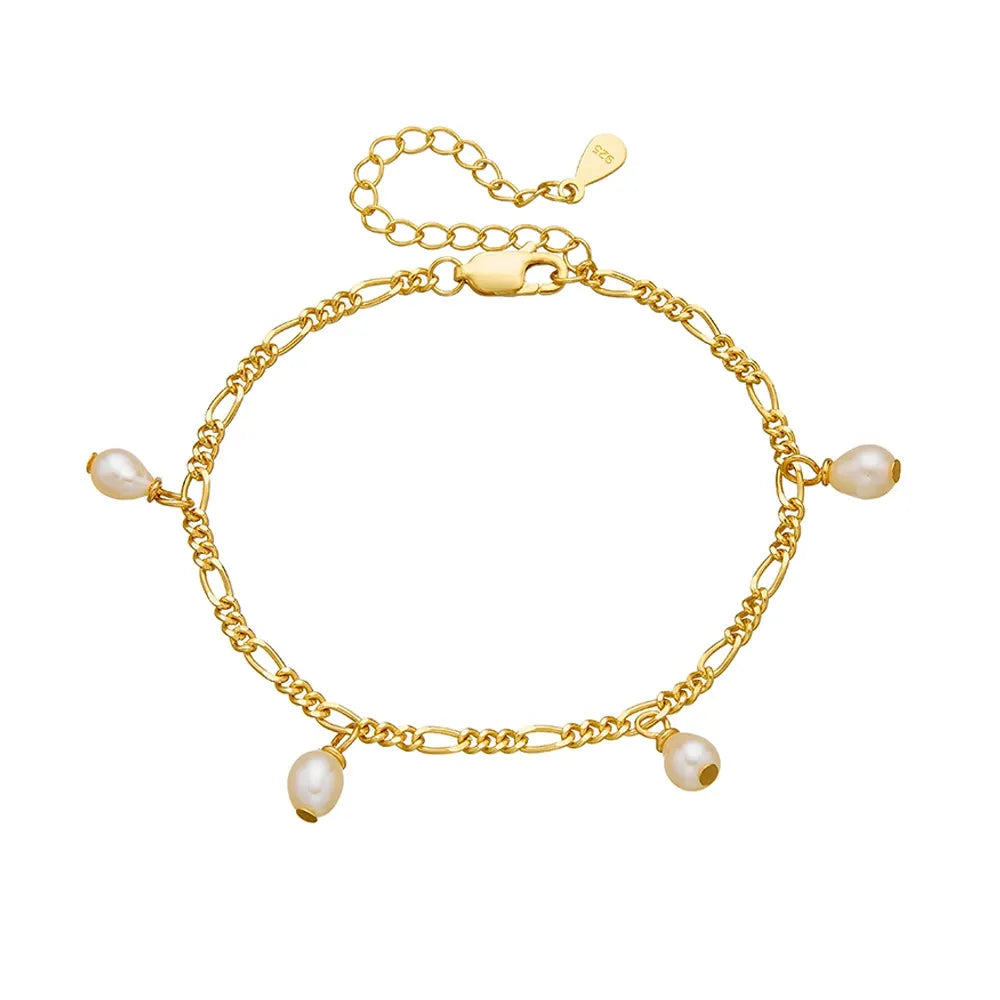 Studio shot of an 18K gold plated S925 sterling silver bracelet featuring a classic Figaro chain and four dangling pearl charms on a white background