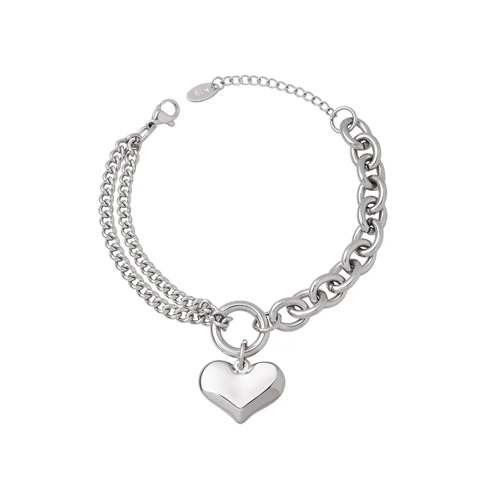 Polished 316L stainless steel bracelet with a puffy heart charm and mixed Cuban link chains.