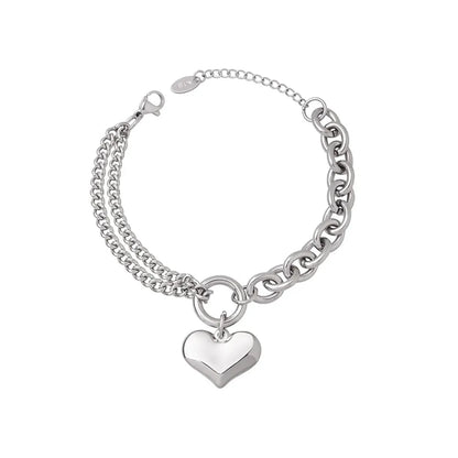 Polished 316L stainless steel bracelet with a puffy heart charm and mixed Cuban link chains.