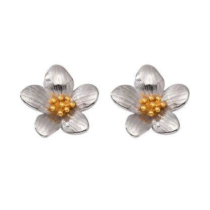 Pair of Helia Statement Flower Studs in polished stainless steel with a contrasting gold center
