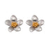 Pair of Helia Statement Flower Studs in polished stainless steel with a contrasting gold center