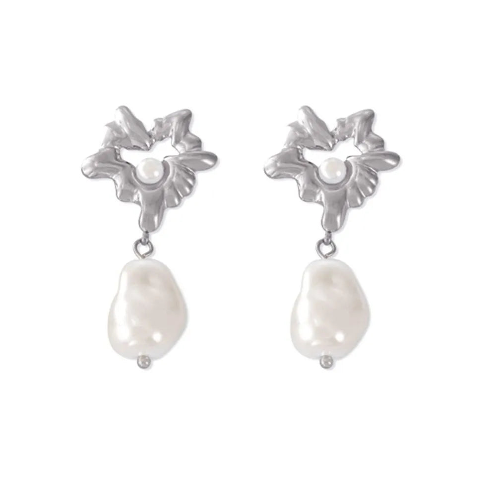 hepburn-heart-pearl-drop-earrings-silver-white-background.webp