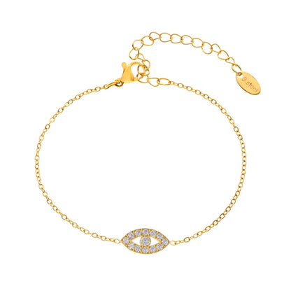 18k gold dainty chain bracelet with a sparkling pavé evil eye charm on a white background
