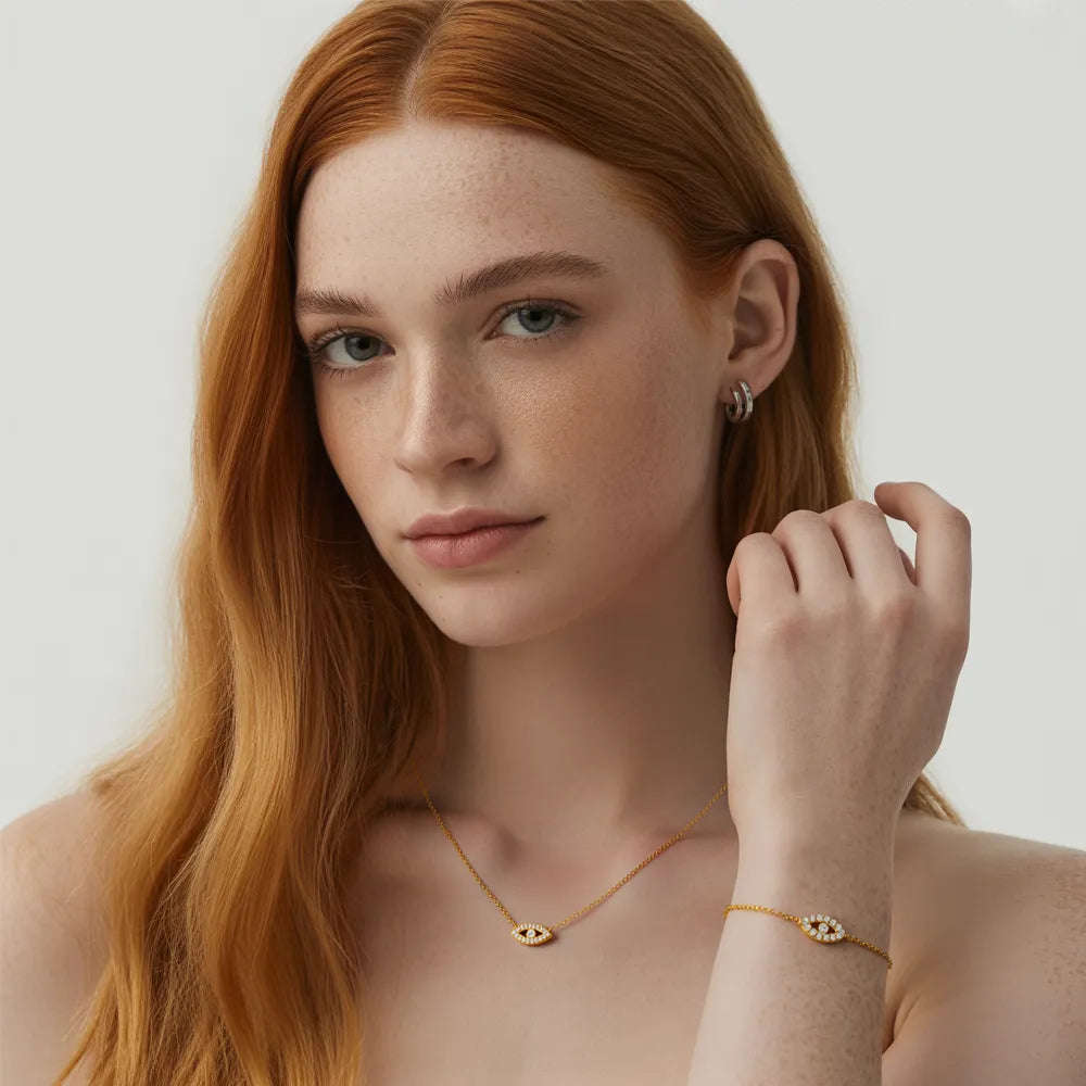 Model wearing the Iris Pavé Eye Charm Necklace and Bracelet set in 18k gold