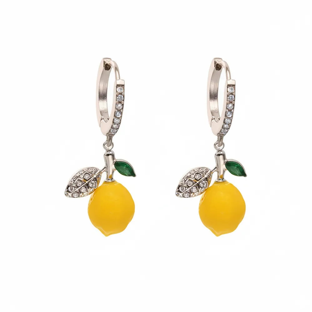 Pair of Lemon Zest Huggie Hoops in polished 316L stainless steel with a yellow enamel charm.