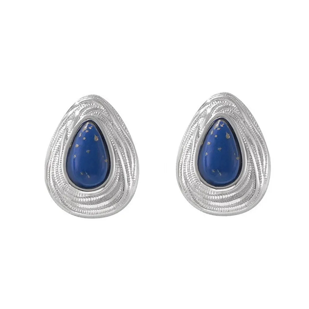 Pair of Lyra Goldstone Stud Earrings in polished 316L stainless steel.
