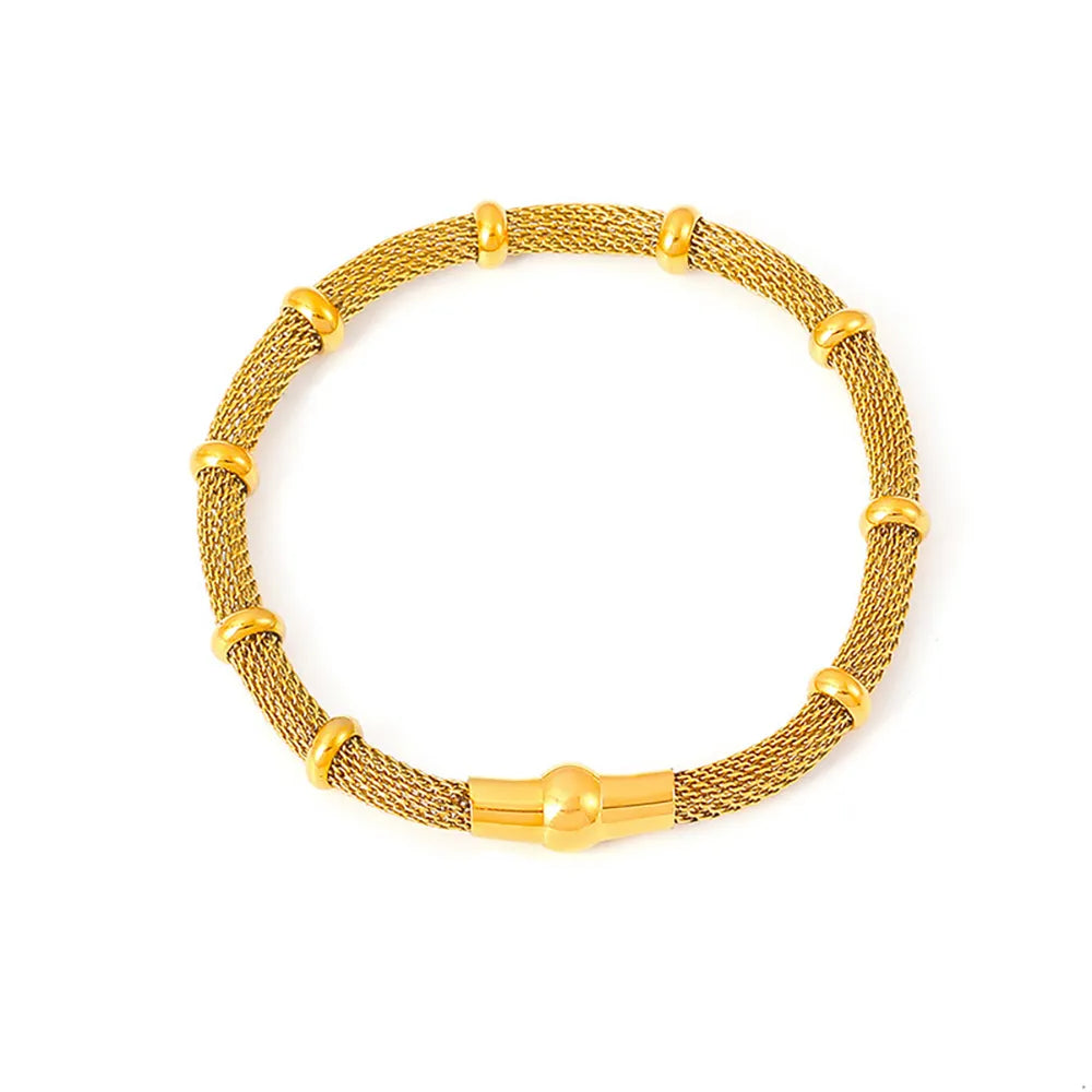 The Milanese Weave Bracelet in a radiant, all-gold 18k plated finish, shown on a white background
