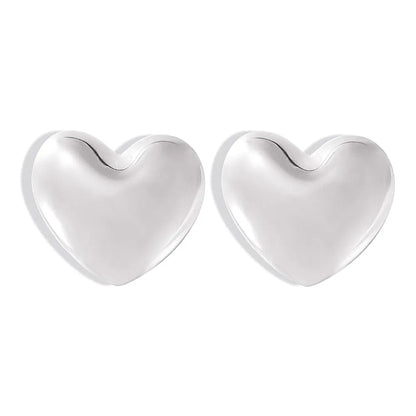 Polished 316L stainless steel heart stud earrings on a white background.