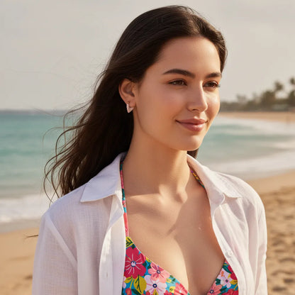 Model wearing the pink enamel heart huggies, showcasing a sweet and romantic jewelry style.-01