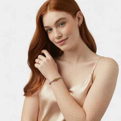 A close-up of the two-tone Milanese Weave Bracelet on a model&