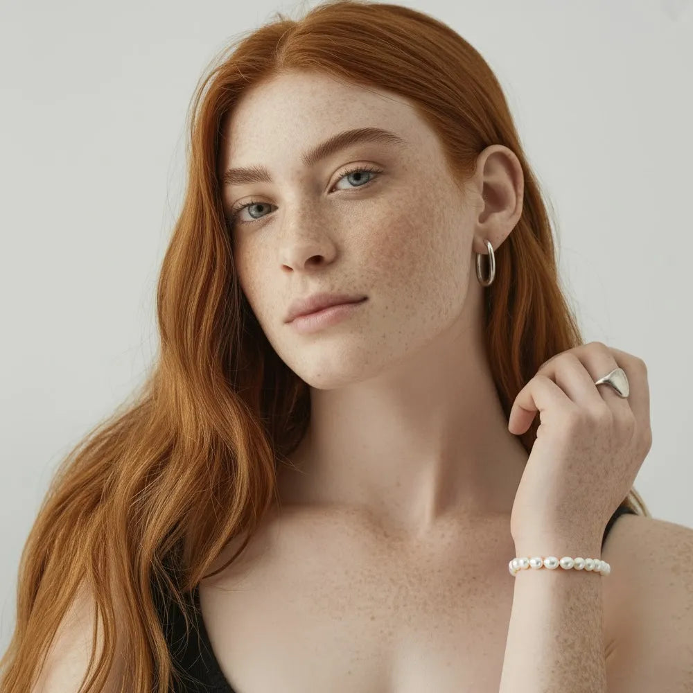 A close-up of the Perla Pearl Station Bracelet on a model&