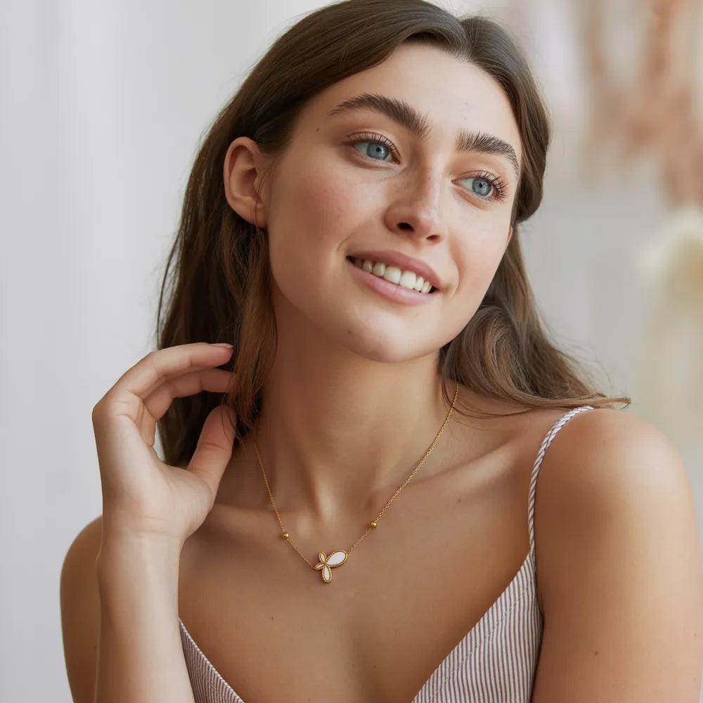 Model wearing the elegant 18k gold plated butterfly mother of pearl necklace, showing its scale and style.