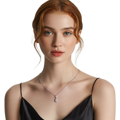 Model wearing the S925 silver pear halo drop necklace, highlighting the brilliant sparkle.