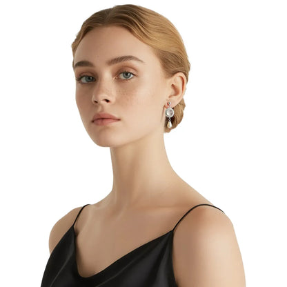 Close-up of model wearing S925 silver teardrop pearl earrings with a halo stud.
