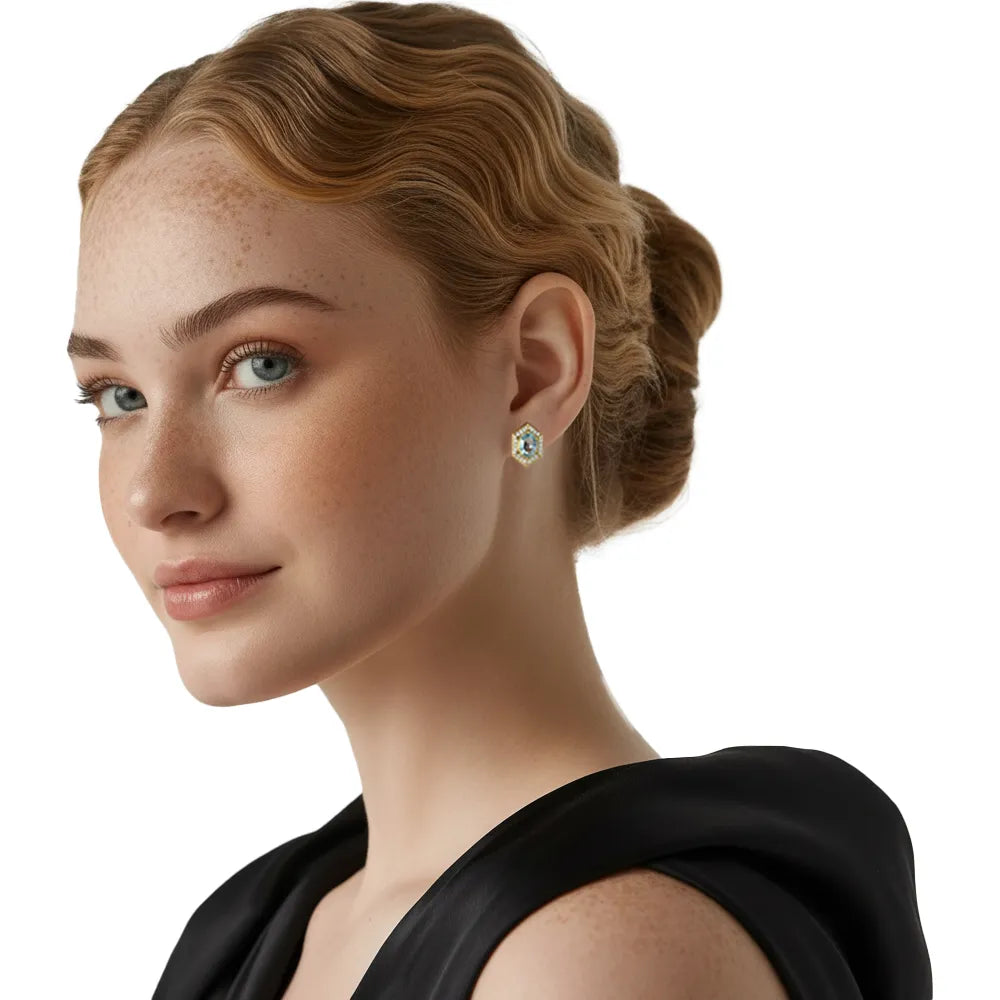 Model wearing the romantic blue topaz hexagon earrings, adding a sophisticated touch to a daily outfit.