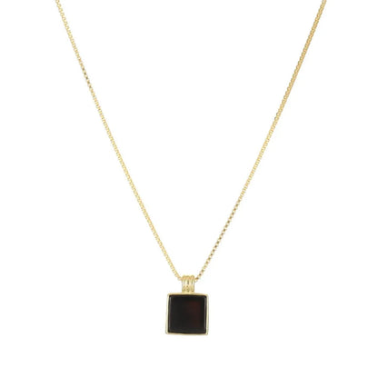 Sleek Onyx Square Tag Necklace in 18k gold plate over S925 silver on a white background