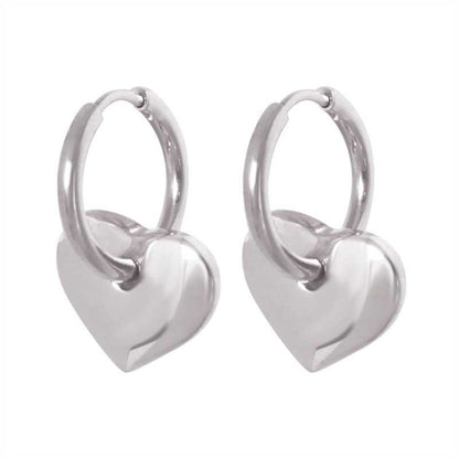 Polished 316L stainless steel hoop earrings with a dangling puffy heart charm.