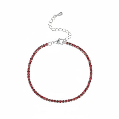 Studio shot of the S925 gold-plated tennis bracelet set with sparkling red zirconia stones.