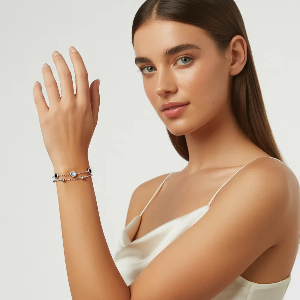 Model wearing the polished 316L stainless steel Roman Station Layered Bracelet