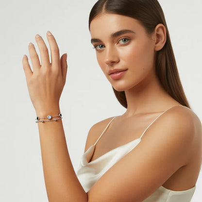 Model wearing the polished 316L stainless steel Roman Station Layered Bracelet