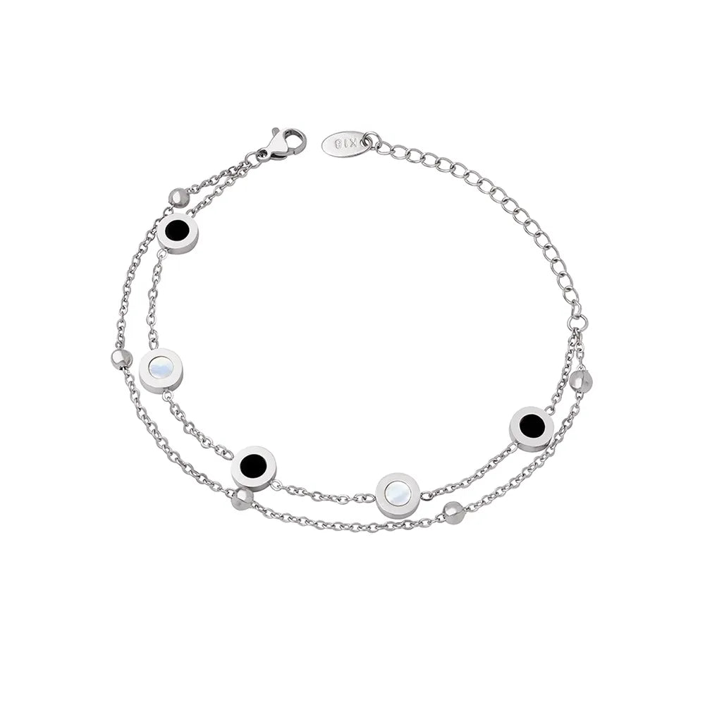Polished 316L stainless steel layered bracelet with mother of pearl and black onyx station charms