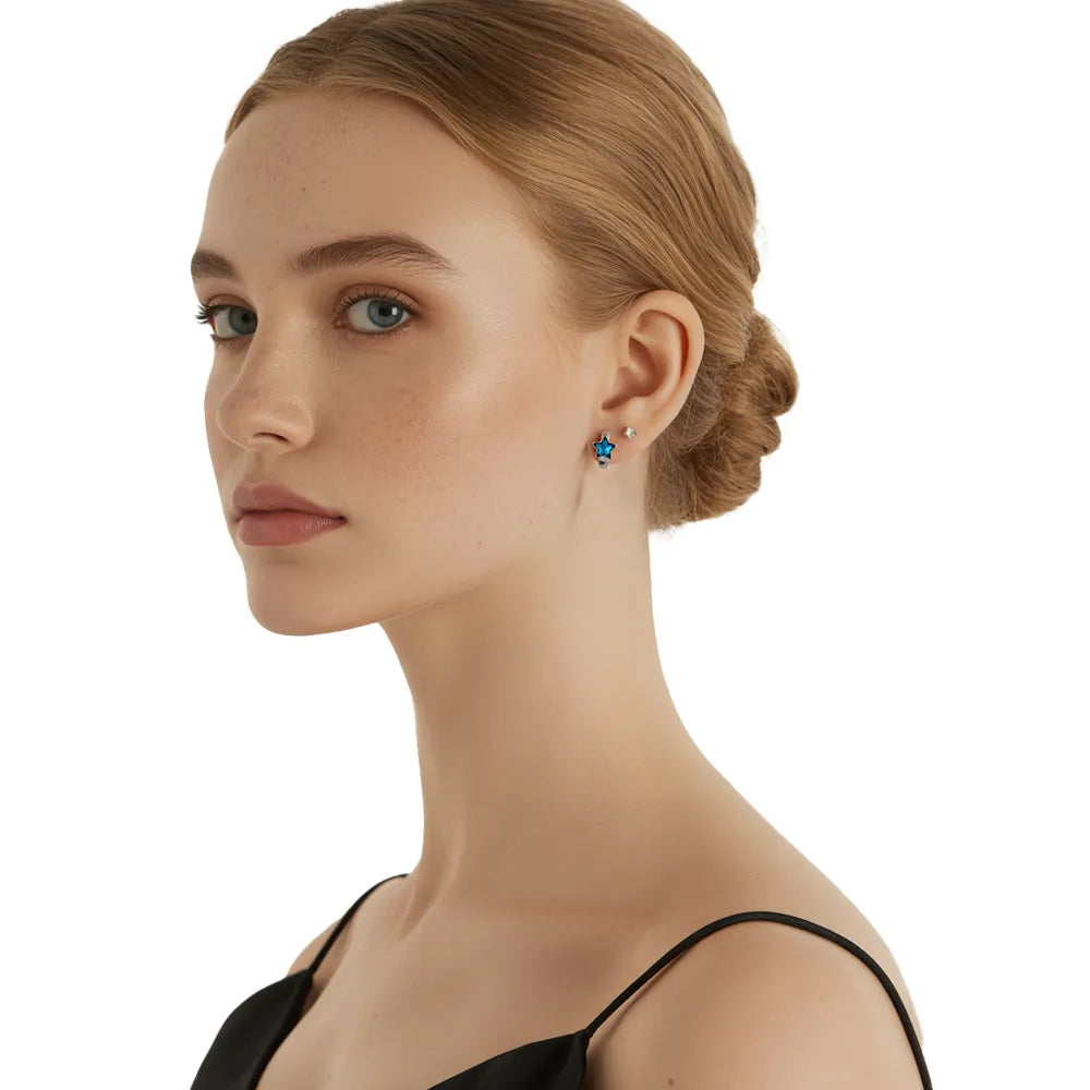 Model wearing the S925 Blue Star Huggie Hoop Earrings, showcasing their snug fit.