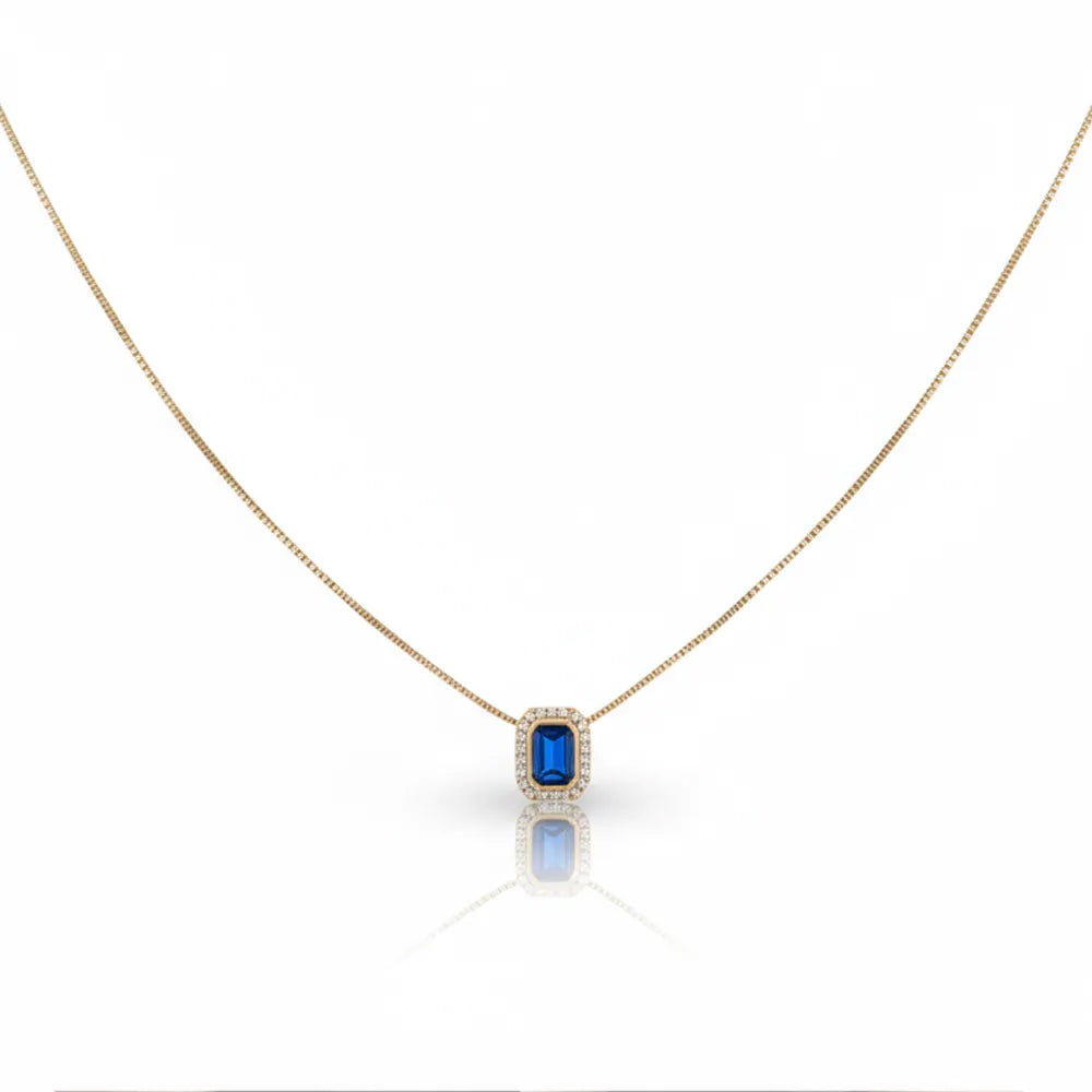 S925 sterling silver necklace with an emerald-cut blue zirconia pendant and pavé halo, 18K gold plated on a white background.