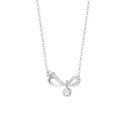 S925 sterling silver pavé infinity bow necklace with a solitaire star charm on a white background