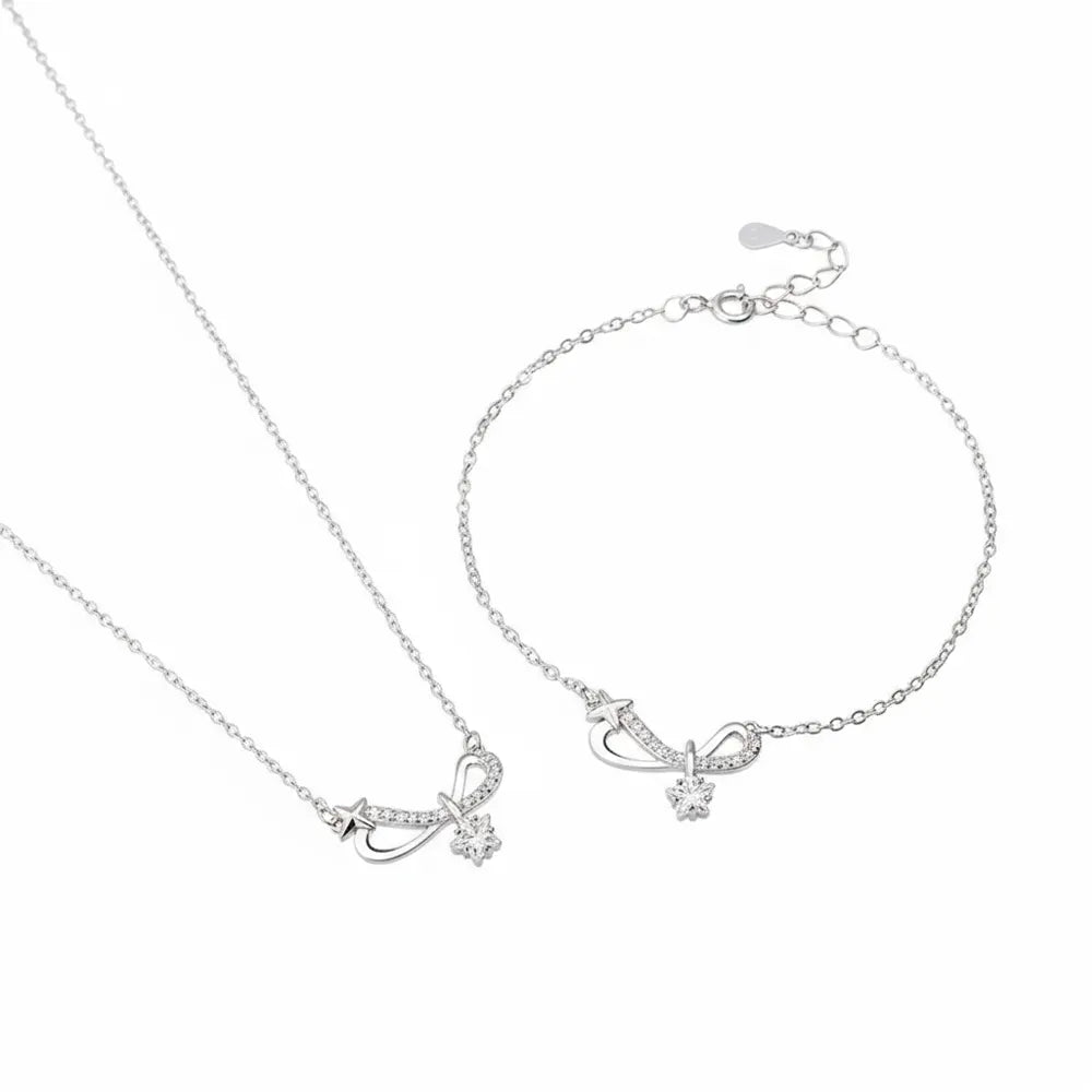 S925 sterling silver pavé infinity bow necklace and bracelet set on a clean white background