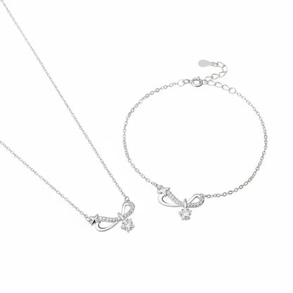 S925 sterling silver pavé infinity bow necklace and bracelet set on a clean white background