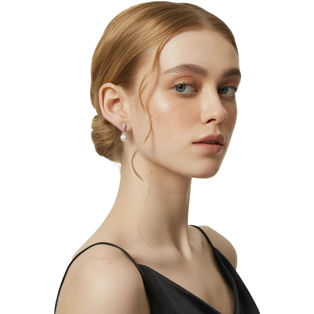 Model wearing the S925 Pavé Pearl Drop Earrings, showcasing their elegant size and sparkle.