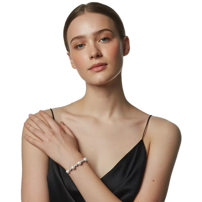 Model showcasing the S925 Pavé Pearl Station Bracelet, complementing a black outfit.