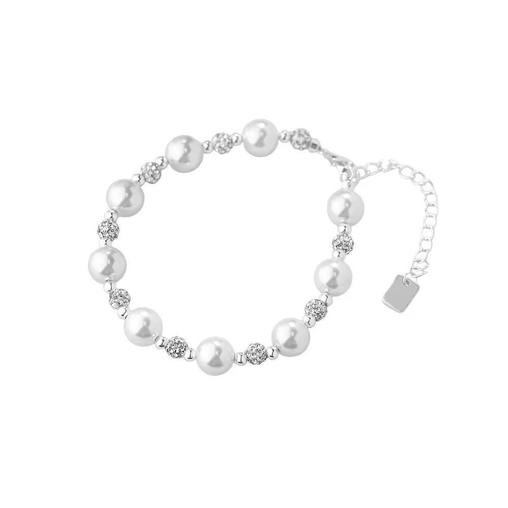 S925 sterling silver bracelet featuring genuine pearls and sparkling pavé cubic zirconia beads on a white background.