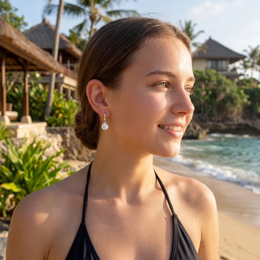 Model showcasing the elegant fit of the S925 Rose Zirconia Stud Earrings on the earlobe.-05