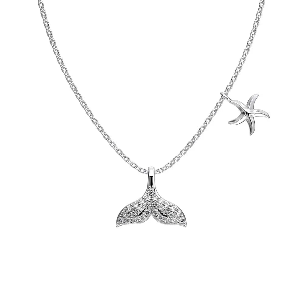 S925 sterling silver necklace featuring a pave crystal whale tail pendant and a side starfish charm.