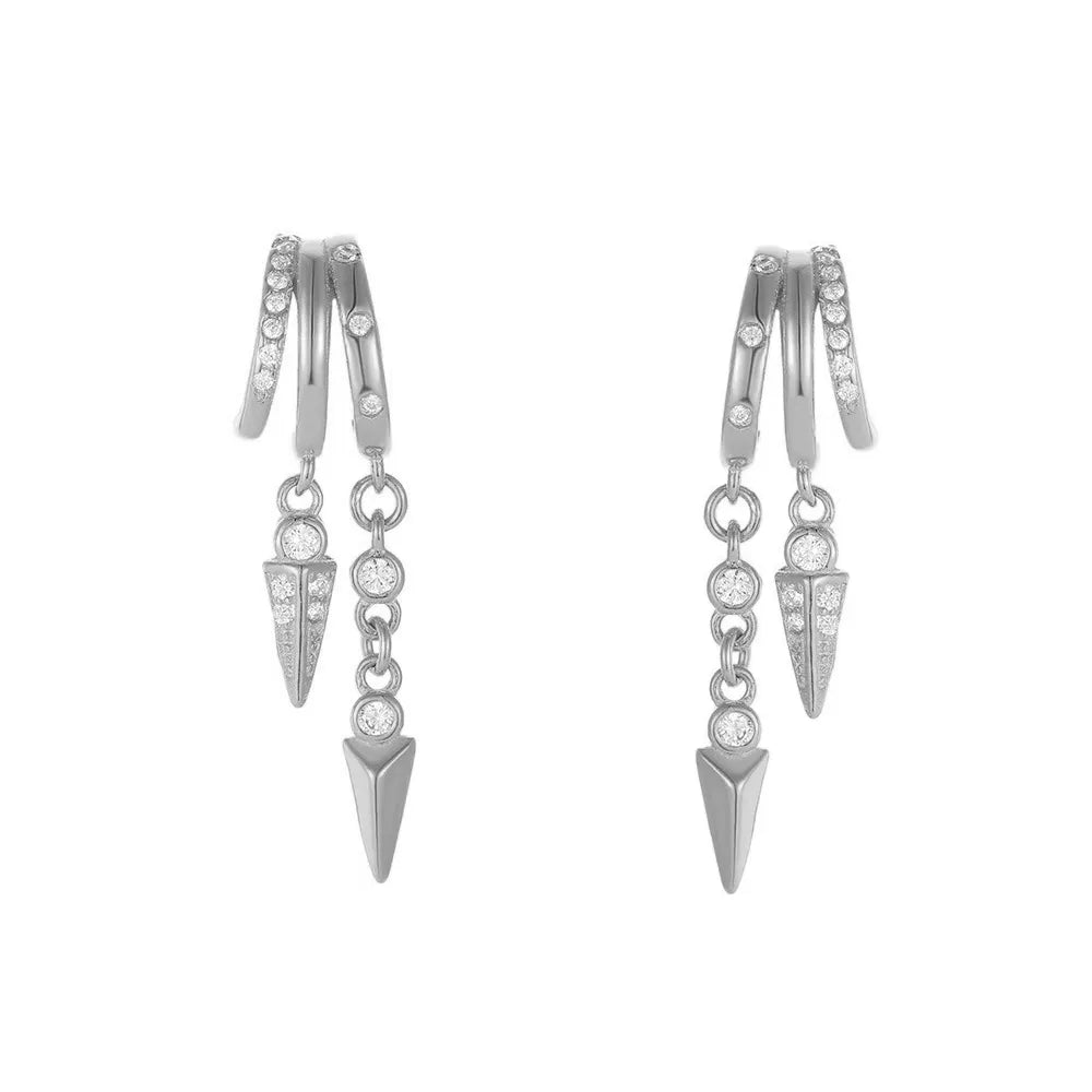 Studio shot of S925 sterling silver illusion hoop earrings with dangling crystal pave spikes, isolated on white background