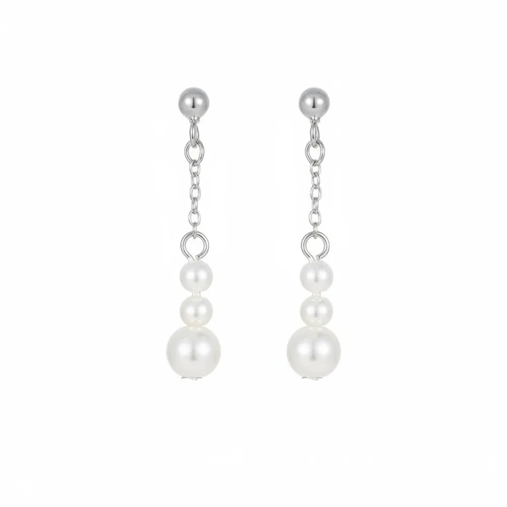 Minimalist silver threader style earrings with increasing size pearls.