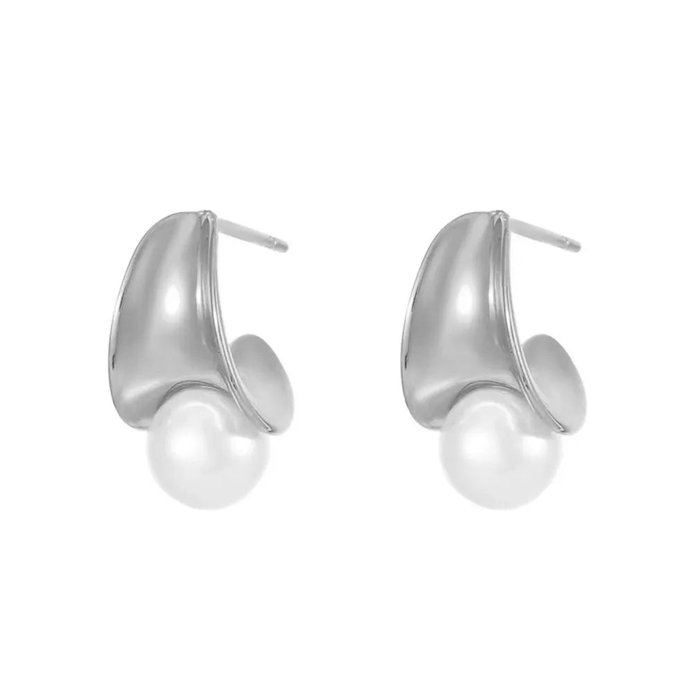 Studio shot of S925 sterling silver half-circle stud earrings featuring a white pearl, isolated on white.