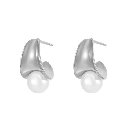 Studio shot of S925 sterling silver half-circle stud earrings featuring a white pearl, isolated on white.