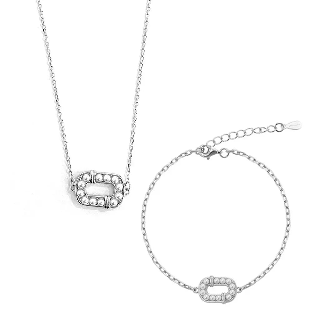 S925 sterling silver 2-piece jewelry set featuring the oval pearl pendant necklace and matching chain bracelet on a white background.