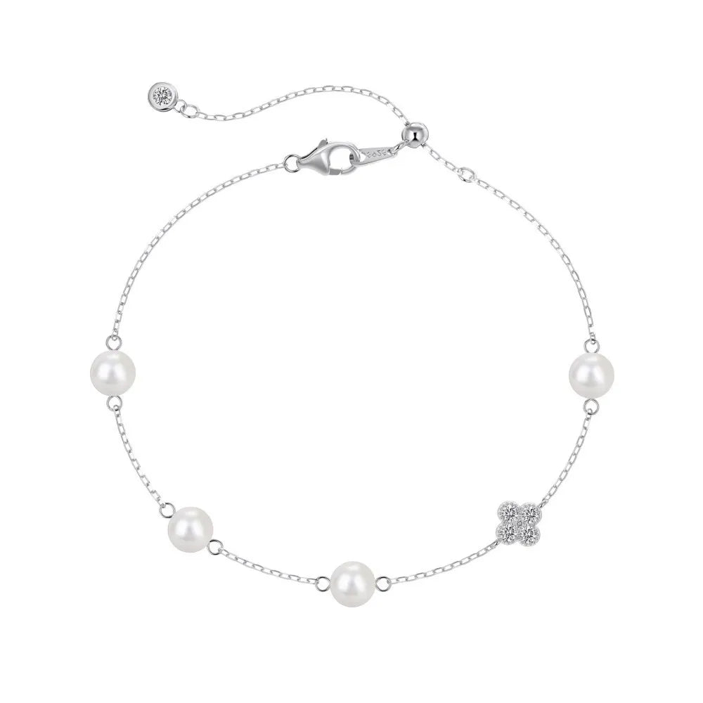 S925 sterling silver chain bracelet with four pearls and a cubic zirconia clover center.